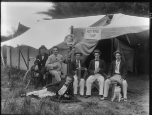 Group of unidentified young men wearing straw boaters, sitting outside a tent, a sign behind them reads 'Red Rose Camp', [New Brighton, Christchurch district?] Christchurch district