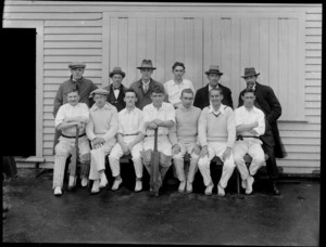 Group of unidentified men's cricket team outside a wooden building, probably Christchurch district