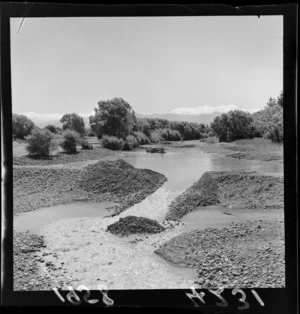 Swimming hole being created in Waipoua River, Masterton, Wairarapa Region, including bulldozer in river moving rocks