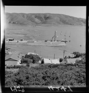 Land reclamation at Paremata for railway (Main Trunk Line) including machinery, workmen, and boats on Porirua Harbour, Wellington Region