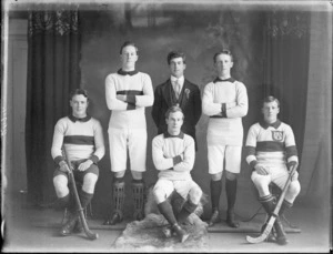 Studio portrait of unidentified hockey players and coach, probably Christchurch district