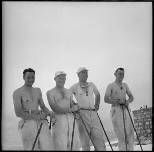 Four trainees stripped to the waist in a snow storm at the Ninth Army Ski School, Lebanon - Photograph taken by M D Elias