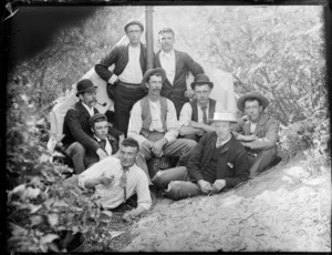 Group of unidentified male youths outside tent, probably Christchurch district, includes male sitting on barrel, which has the words 'Chili Beer' written on it