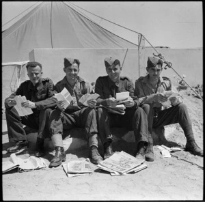 Group of repats from Italy reading mail, Maadi - Photograph taken by M D Elias