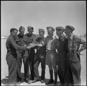 Group of repats from Italy experiencing decent cigarettes for a change - Photograph taken by M D Elias