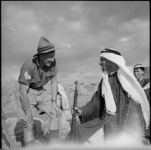 NZ soldier talks with an arab of Trans Jordania, World War II - Photograph taken by M D Elias