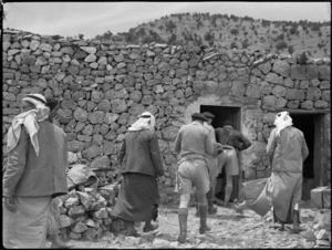 Members of NZ Divisional Cavalry entering Syrian chief's hut, World War II - Photograph taken by H Paton