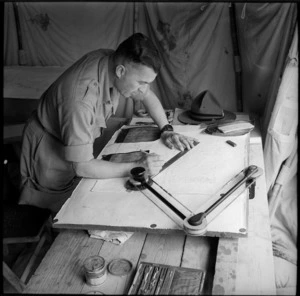Draughtsman of 36 NZ Survey Battery at work in Palestine, World War II - Photograph taken by M D Elias