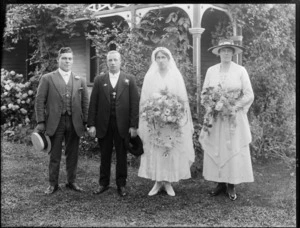 Unidentified wedding group outdoors in garden, showing bride and groom, groomsman and bridesmaid, probably Christchurch district