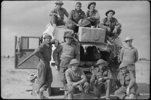Members of the NZ Field regiment with a truck near missed by an enemy shell, Libya, World War II