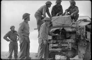 Members of a NZ Field regiment with their truck near missed by an enemy shell, Libya, World War II
