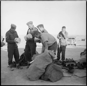 NZ troops collecting parcels from advanced post office after withdrawl from Libyan battle, World War II