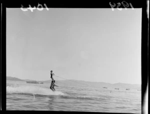 Water skiing demonstration off Petone Beach, Lower Hutt, Wellington Region, featuring human pyramid and including spectator boats