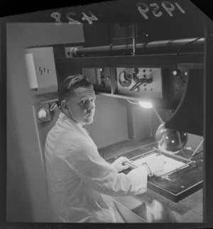 Unidentified man preparing the cartoon for photographing for a film being produced in Levin