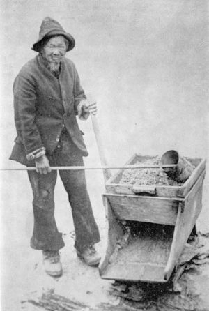 Chinese gold miner, Wing Chung, with cradle on the banks of the Clutha River