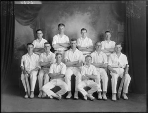 Studio portrait of unidentified men's cricket team in whites with cricket bats, Christchurch