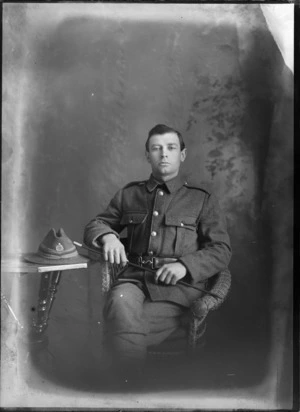 Studio portrait of an unidentified man in a military uniform, sitting, possibly Christchurch