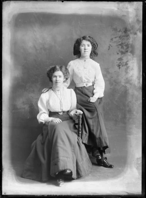 Studio portrait of two unidentified young women, one wearing a pearl choker necklace, possibly Christchurch district