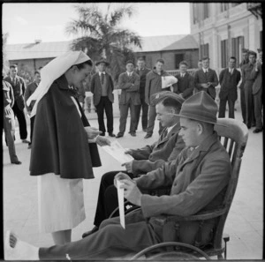 Cpl Moore, DCM, and Bdr Hutchinson talking with Sister Wilson after awards presentation at Helwan Hospital, Egypt - Photograph taken by M D Elias