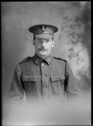 Studio upper torso portrait of older unidentified world War One soldier with handlebar moustache, collar and hat badges [NZ Rifle Brigade?], Christchurch
