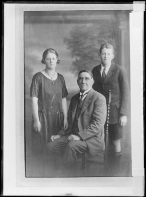 Studio portrait of an unidentified family group, showing a man, boy and young woman, possibly Christchurch district