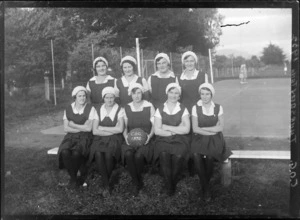 Women's basketball team, Hastings, showing COG [Convent Old Girls?] written on the ball