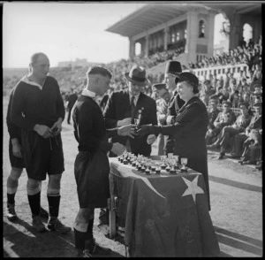 Presentation of cups to players in the NZEF v Rest of Egypt rugby match at Alexandria, Egypt