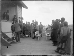 View of men outside the [rifle] clubhouse celebrating, Hawke's Bay District