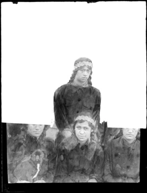 Masked photo of two young Maori women with braided hair and flax headbands, Hawke's Bay District