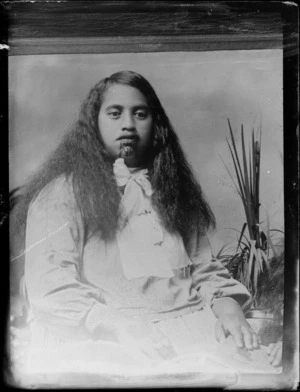 Unidentified Maori woman with a moko, wearing a bow scarf, probably Hastings district