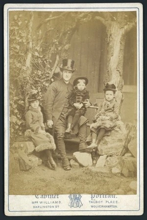 Unidentified clergyman, wife and child
