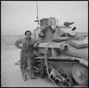 Divisional Cavalry trooper standing by a light tank, Egypt, World War II