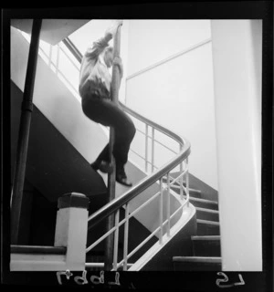 Fireman coming down pole, Central Fire Station, Wellington