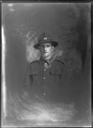 Studio upper torso portrait of unidentified young World War One soldier and hat with 'C8 silver fern' [8th Reinforcements C Squadron/Company?] badge, Christchurch