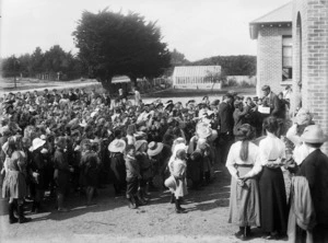 Crowd of school children at a Stratford school during a presentation ceremony to L Mail