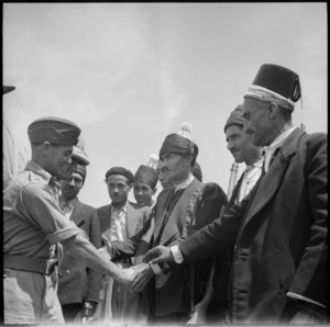 Major H S Hanton being received at a Kurdish feast in Syria, World War II - Photograph taken by M D Elias