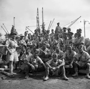 Elias, M D :Padre Wi Tetau Huata leading members of the Maori Battalion in a song, Alexandria, Egypt, during World War II