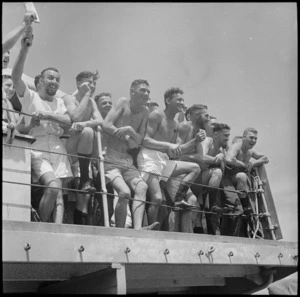 Crew members of HMS Leander watching water polo in Alexandria Harbour - Photograph taken by M D Elias