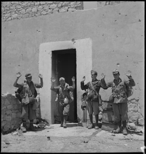 Italian prisoners standing outside house in Tunisia - Photograph taken by M D Elias