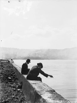 Men fishing off reclamation, Wellington Harbour