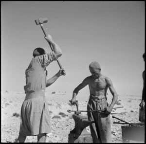 Blacksmiths from a NZ LAD at work in the Western Desert, World War II - Photograph taken by H Paton
