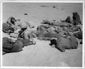 Exhausted POWs rest on ground in the Alamein area, Egypt