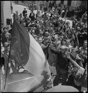 Population of Tunis demonstrating with French flag, World War II - Photograph taken by M D Elias