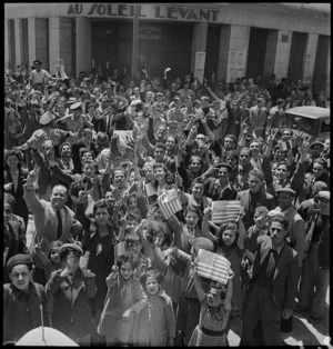 Population of Tunis demonstrating with American flags, World War II - Photograph taken by M D Elias