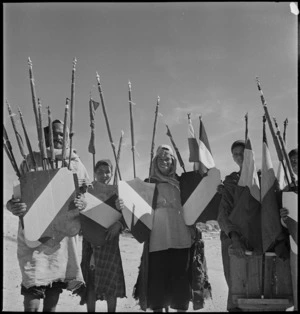 Local inhabitants with decorations for sale for victory celebrations, Tunis - Photograph taken by M D Elias