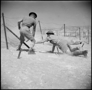 Sappers preparing to blow up barbed wire with a Bangalore Torpedo, Egypt