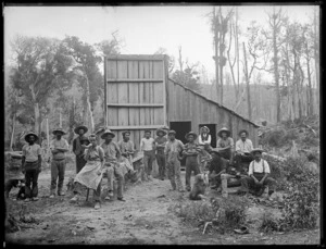 Group of men outside a dwelling in a timber camp