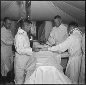 Doctors of field ambulance unit prepare for minor operation in surgical tent, Egypt