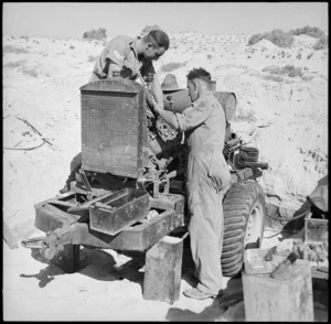 Ordnance personnel working on an air compressor in the Western Desert