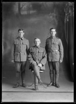Studio portrait of three unidentified young men, wearing military uniforms, possibly Christchurch district